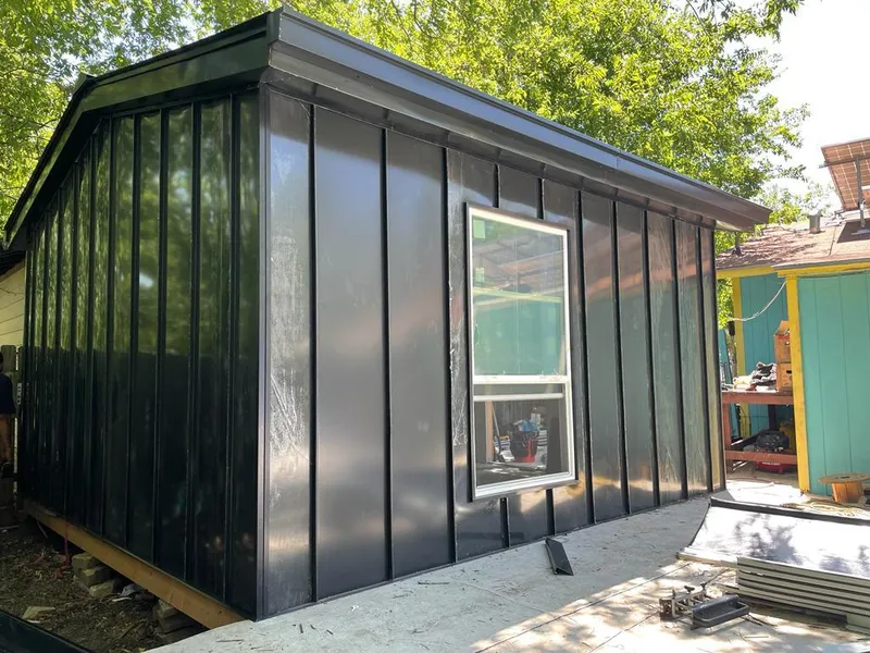 Black standing seam metal wall panels for Roof Inspection in Alton