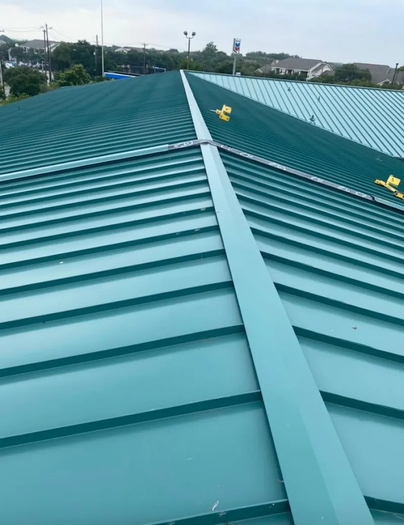 Green commercial metal roof ridge and valley for Metal Roof Repair in Alton